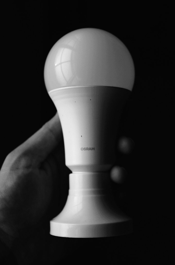 A hand holding a light bulb

Description automatically generated with medium confidence